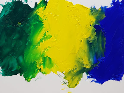 Basic Green at left mixing with Basic Yellow at center. Basic Blue, shown far right, makes a different green mixture with the Basic Yellow.