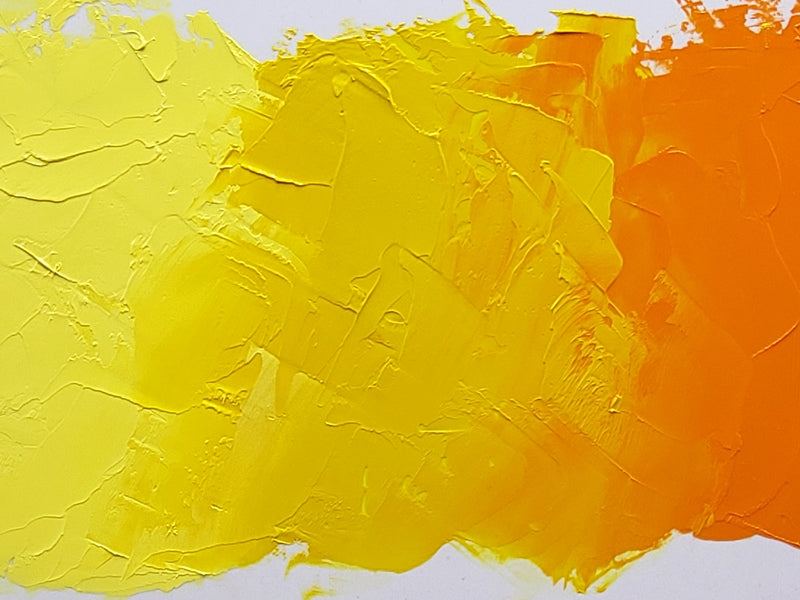 Brilliant Lemon Light is shown at left mixing into Sulphur Yellow at center. At far right is Cadmium Yellow Orange and the mixture it makes with the Sulphur Yellow at center right.