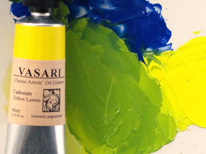 Cadmium Yellow Lemon with tube at left and paint at far right. Our Cobalt Blue is at top mixing into the Cadmium Yellow Lemon to create a soft, natural pale green